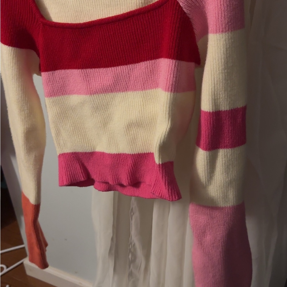 Red and Pink Off-the-Shoulder Sweater with Ruffled Detail